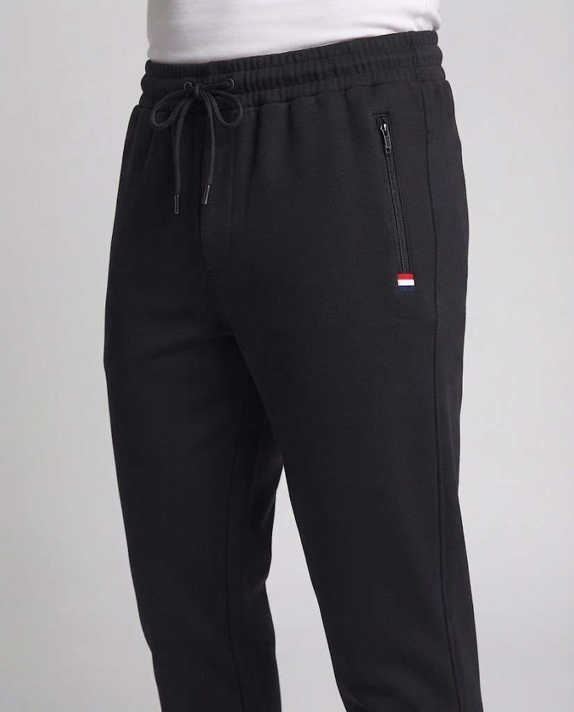 Herren Sportliche Joggerhose mit Reißverschlusstasche, elastischem Bund und geripptem Saum Echoarchiv