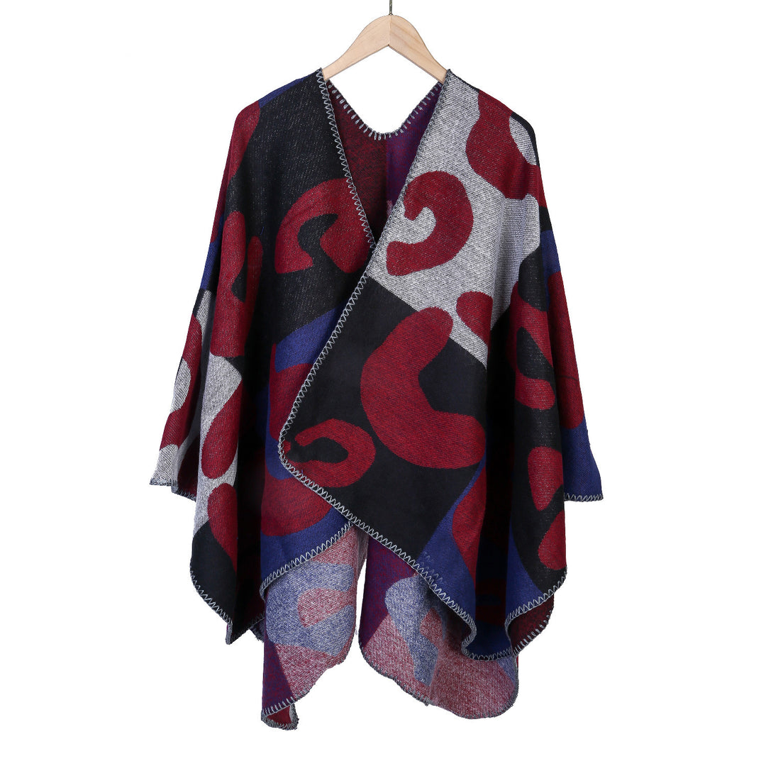 Damen Oversize-Ruana mit abstraktem Grafikjacquard und dekorativer Kettelnaht – Avérine
