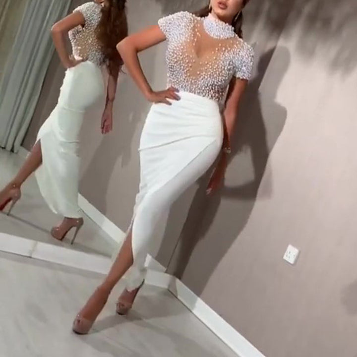 Damen Elegantes Kleid mit transparenten Puffärmeln und Perlenakzenten Echo Archiv