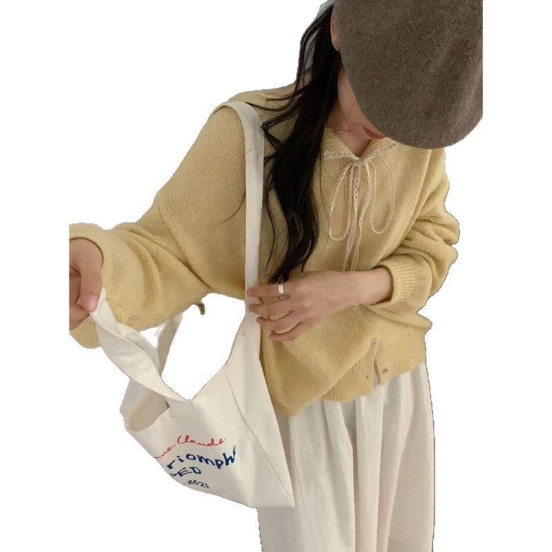 Damen-Strickjacke mit Spitzenkragen und Bindeband