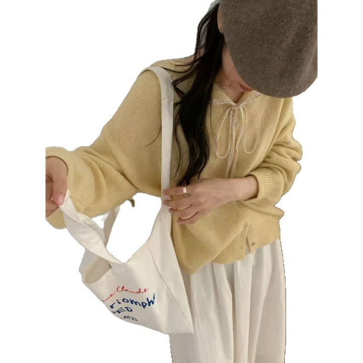 Damen-Strickjacke mit Spitzenkragen und Bindeband