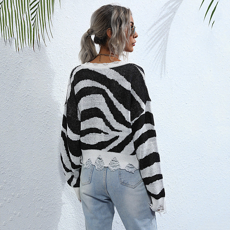 Damen Oversize V-Ausschnitt Strickpullover mit Zebramuster und ausgefranstem Saum Echoarchiv