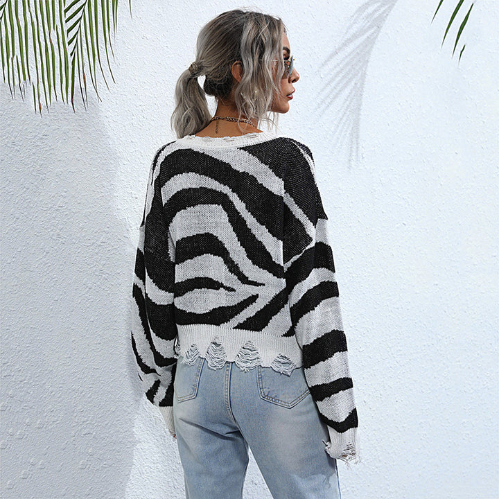 Damen Oversize V-Ausschnitt Strickpullover mit Zebramuster und ausgefranstem Saum Echoarchiv