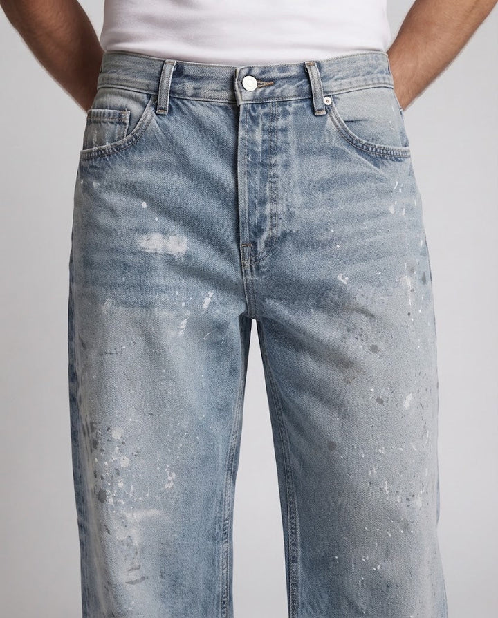 Herren weit geschnittene Vintage-Denim Jeans mit Used-Effekten und Paint-Splatter Echo Archiv