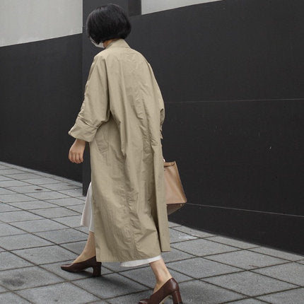 Damen Langer Oversize-Dustercoat mit Rückenschlitz, überschnittener Schulter und praktischen Eingrifftaschen – Célinea