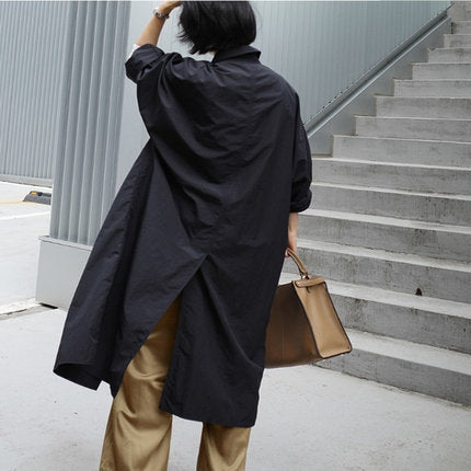 Damen Langer Oversize-Dustercoat mit Rückenschlitz, überschnittener Schulter und praktischen Eingrifftaschen – Célinea