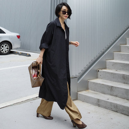 Damen Langer Oversize-Dustercoat mit Rückenschlitz, überschnittener Schulter und praktischen Eingrifftaschen – Célinea
