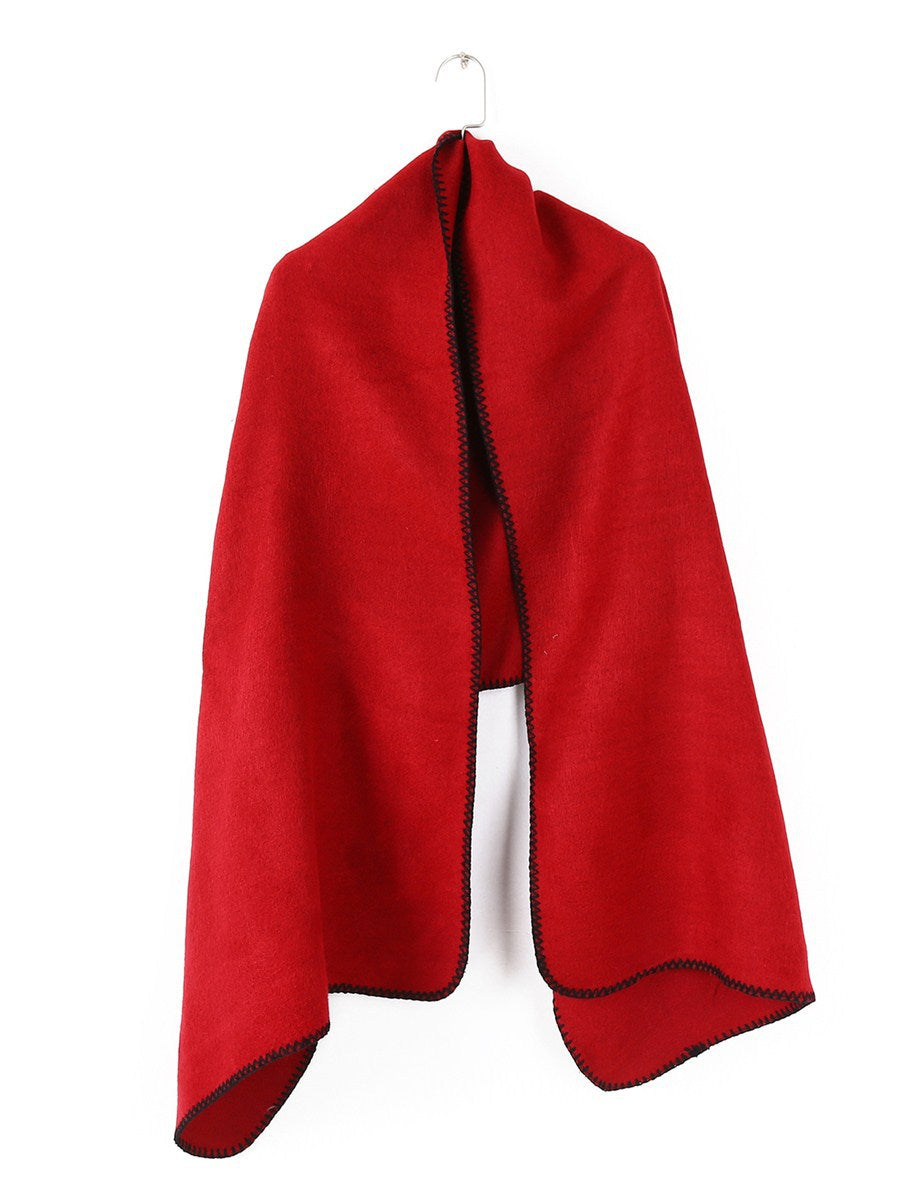 Damen Übergroßer Ruana-Poncho mit Armausschnitten und kontrastierender Kettelnaht – Célinea
