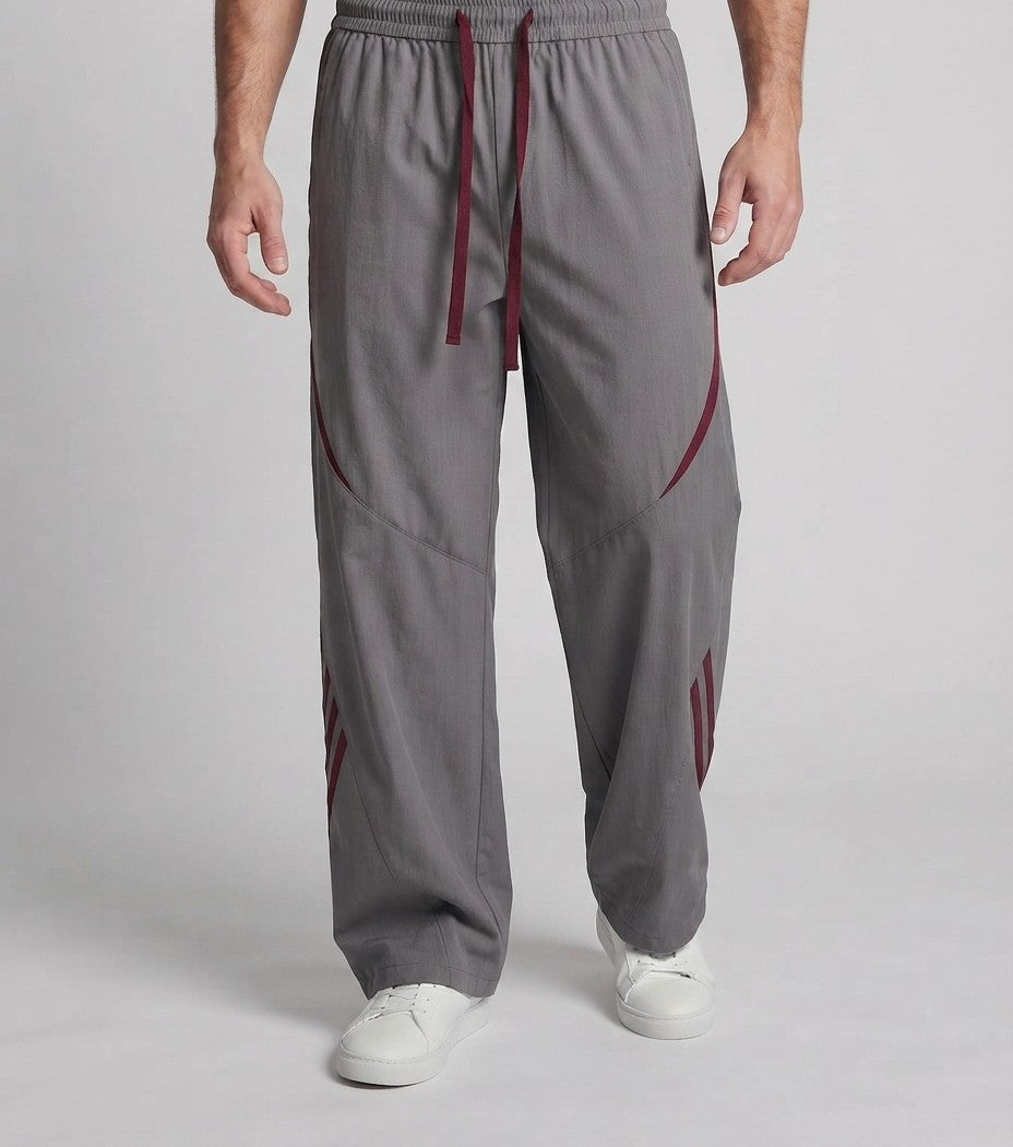 Herren Extra Breite Nylon Jogginghosen im Baggy-Schnitt mit Kordelzug, dekorativen Paneelen und seitlichen Kontraststreifen Echoarchiv