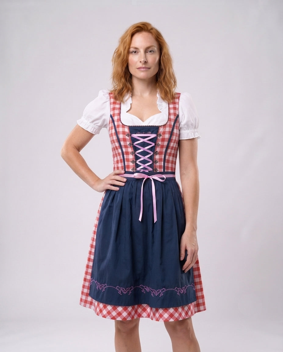 Frauen traditionelles Kleid mit kariertem Oberteil und eleganten Rüschendetails Echo Archiv