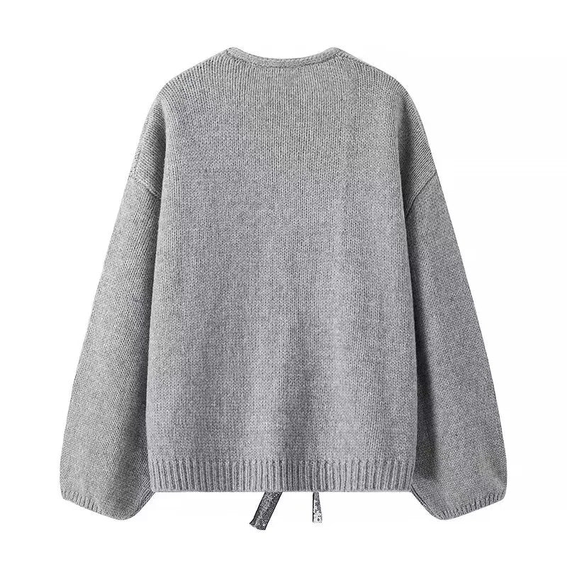 Damen Oversize-Strickcardigan mit tiefem V-Ausschnitt und dekorativen Pailletten-Schleifen – Veloura