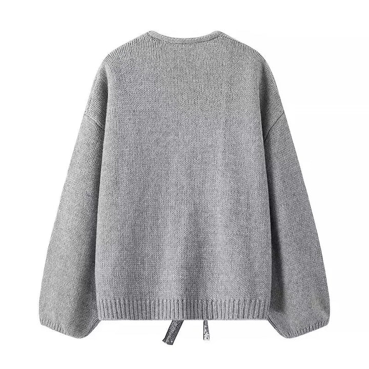 Damen Oversize-Strickcardigan mit tiefem V-Ausschnitt und dekorativen Pailletten-Schleifen – Veloura