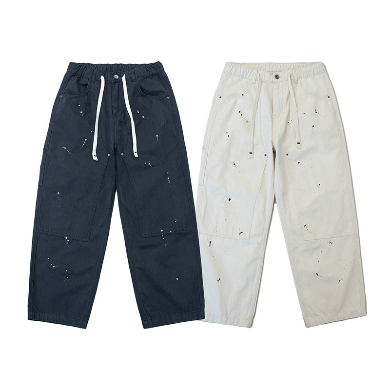 Unisex Weite Canvas-Hose mit elastischem Bund, Tunnelzug und Paint‑Splatter‑Details Echoarchiv