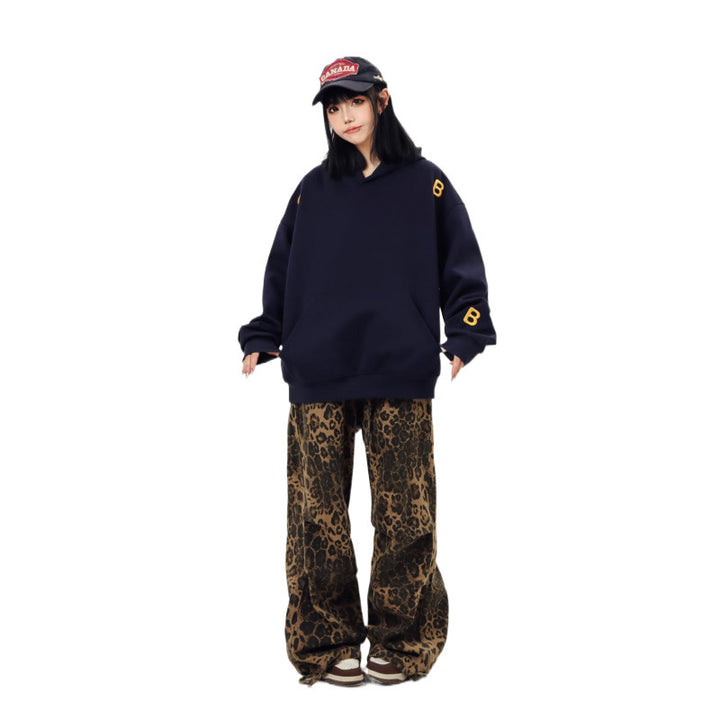 Unisex Oversized Kapuzenpullover mit großflächigem Intarsien‑Blockprint und geripptem Saum Echoarchiv