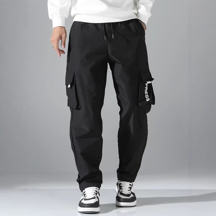 Herren Tapered Cargo-Jogginghose mit elastischem Tunnelzug, multifunktionalen Klapptaschen & ergonomischen Nähten Echo Archiv