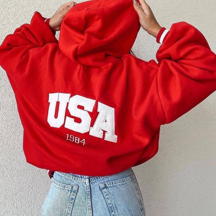 Damen Kurz geschnittener Oversize-Kapuzenpullover mit aufgenähter College-Applikation und gerippten Bündchen Echoarchiv