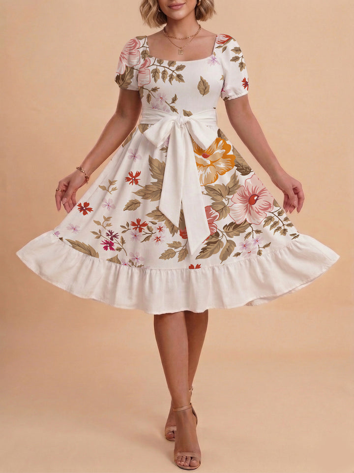 Damen Sommerliches Blumenkleid mit taillierbarem Gürtel und voluminösen Ärmeln Echo Archiv
