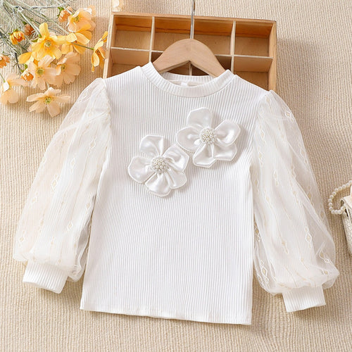 Mädchen modische Bluse mit transparenten Puffärmeln und floralen Akzenten Echo Archiv