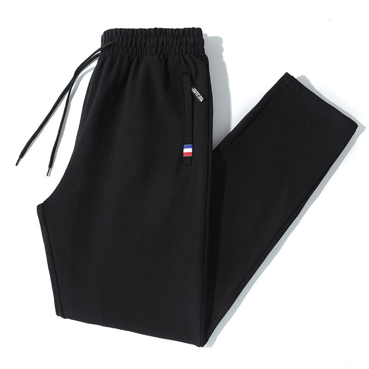 Herren Tapered-Jogginghose mit Tunnelzug, Reißverschlusstasche & Rippbündchen Echo Archiv