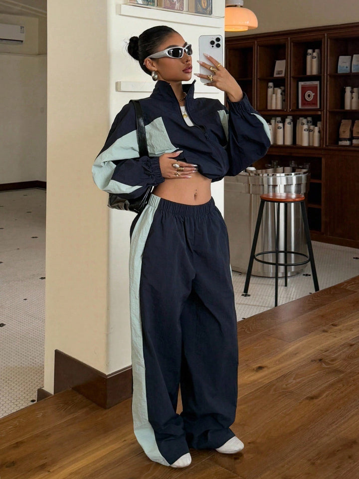 Damen Cropped-Trainingsjacke und hochgeschnittene Breitbein-Jogginghose im Set Echo Archiv