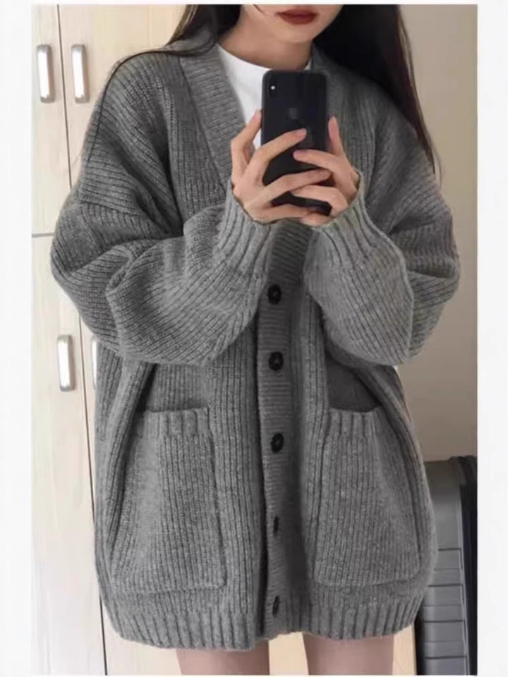 Damen Oversize Strickcardigan mit aufgesetzten Taschen und durchgehender Knopfleiste Echoarchiv