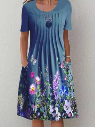 Damen Plissee Midi Kleid mit kurzen Ärmeln, seitlichen Taschen und floralem Saum – Élara