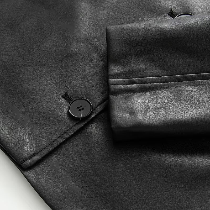 Damen kurze Kunstleder‑Trenchjacke mit Taillengürtel und Schultercape Echoarchiv
