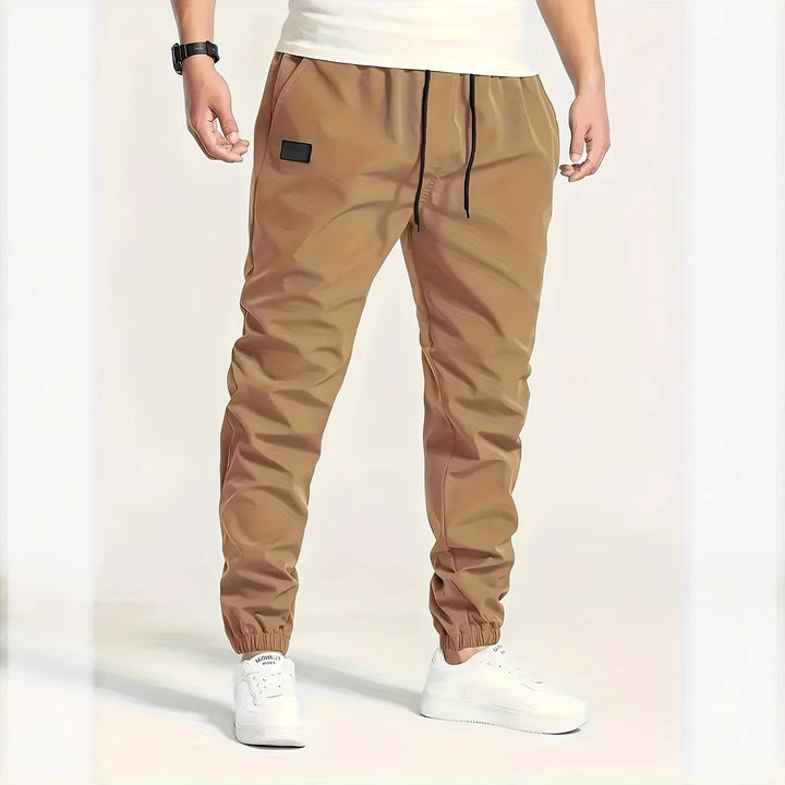 Herren Technische Jogginghose im Tapered‑Utility‑Stil mit elastischem Bund & Knöchelbündchen Echo Archiv