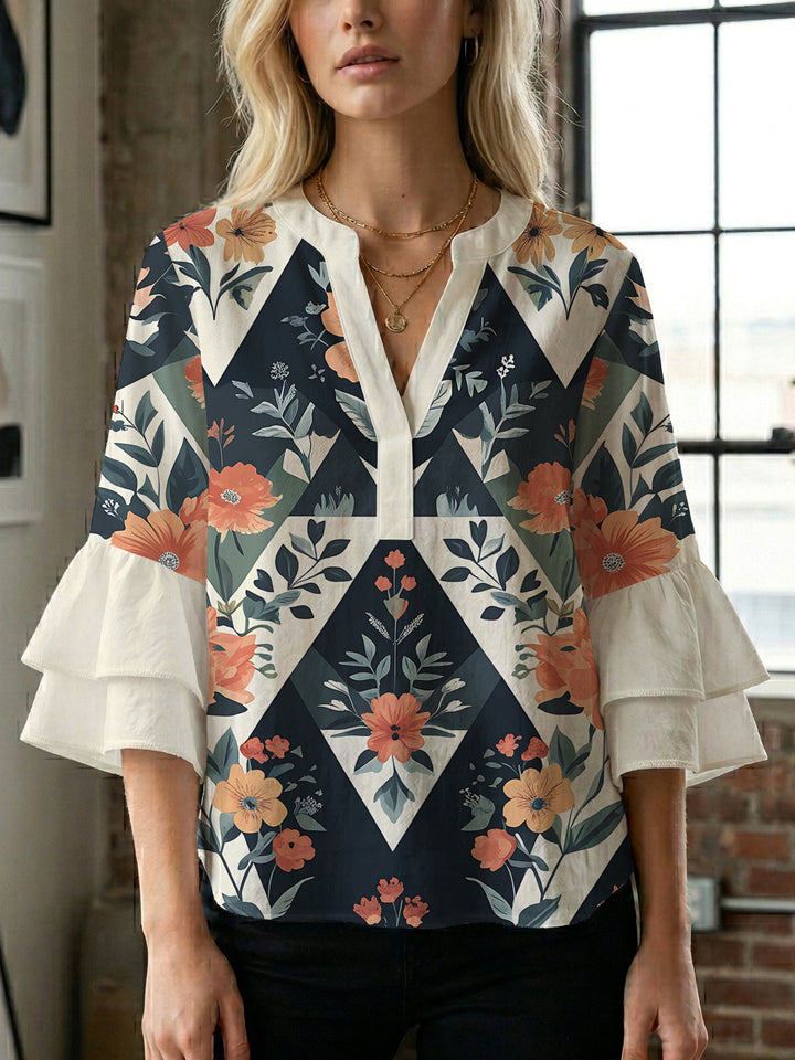 Damen Bluse mit voluminösen Rüschenärmeln und modernem Motiv Echo Archiv