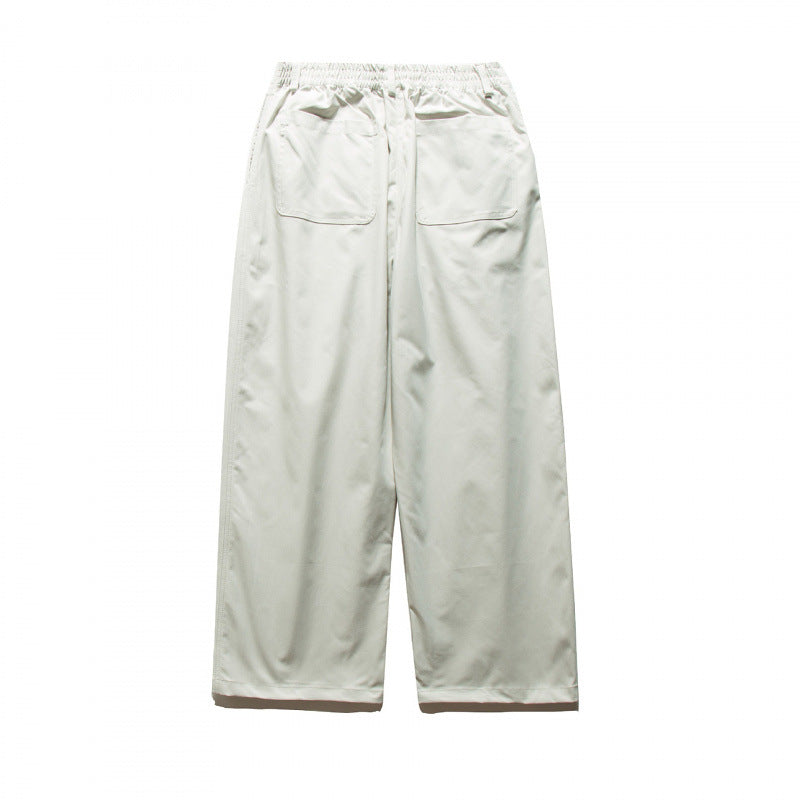 Unisex Weite Plissee-Hose mit elastischem Bund und Bundfalten Echo Archiv
