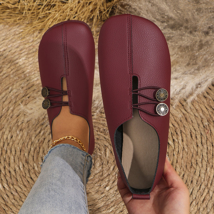 Damen  flache Slipper-Pantoletten aus Wildlederoptik mit elastischer Schnürung und dekorativem Zierknopf Echo Archiv