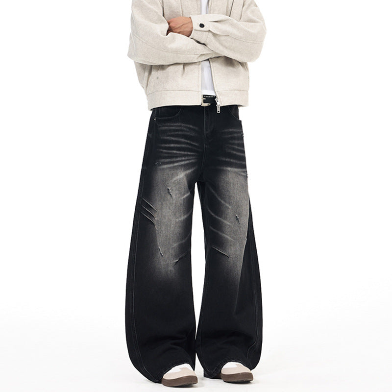 Herren Ultraweite Denim-Palazzohose mit skulpturalen Seitenbahnen und Used‑Effekt Echo Archiv