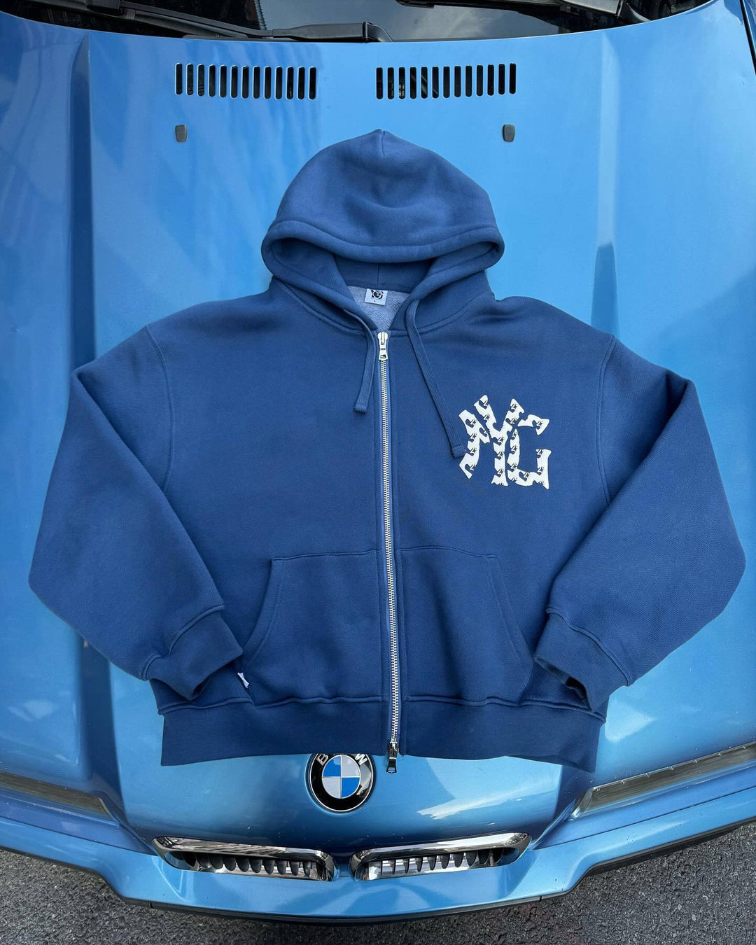 Unisex nan weit geschnittene Kapuzen-Sweatjacke mit beidseitig öffnendem Reißverschluss und Logo-Applikation Echo Archiv