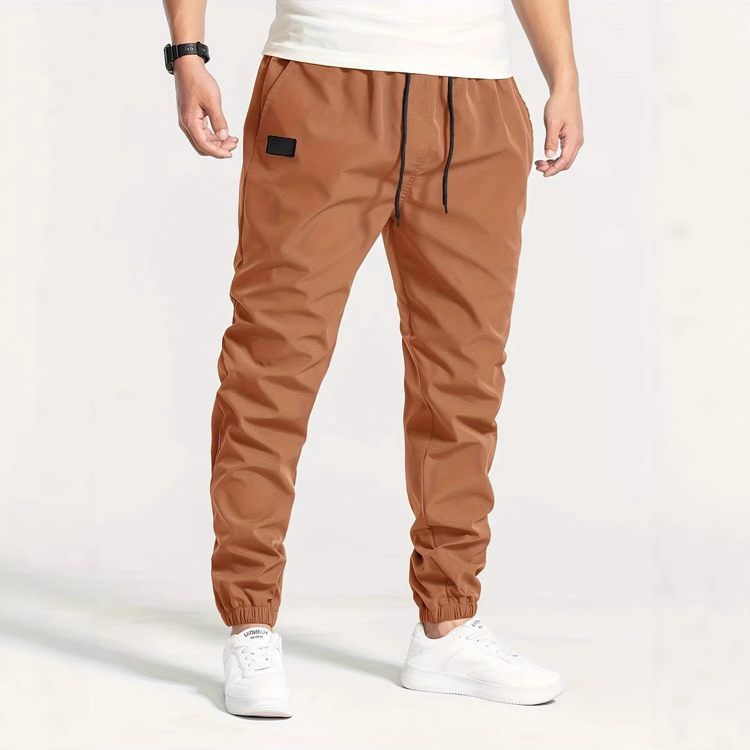 Herren Technische Jogginghose im Tapered‑Utility‑Stil mit elastischem Bund & Knöchelbündchen Echo Archiv