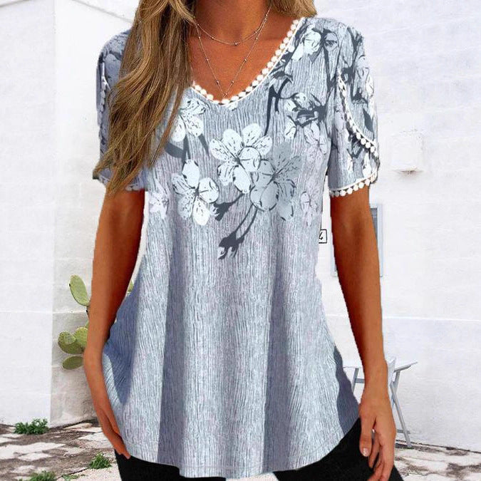 Damen nan legeres V-Ausschnitt-Tunikashirt mit floralem Muster und Pomponbesatz Echo Archiv