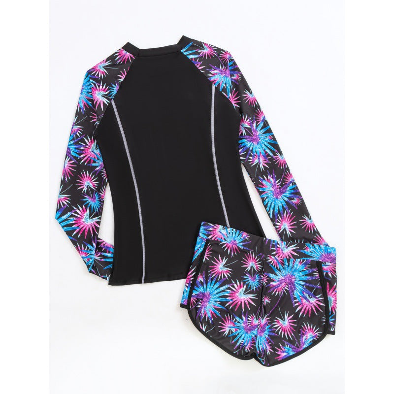 Damen Rashguard mit sportlichen Shorts und trendigem Blumenmuster Echo Archiv