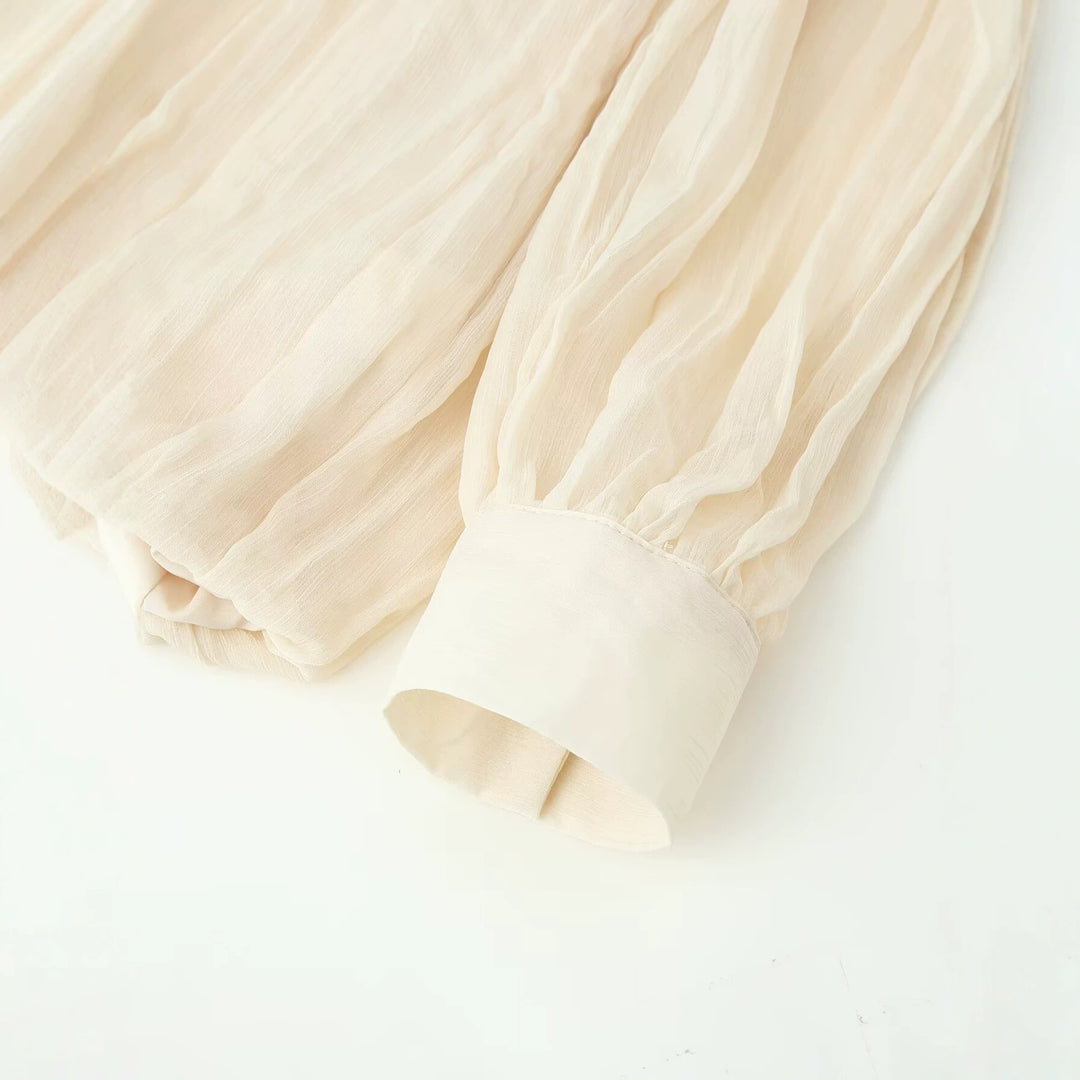 Damen Fließende Chiffon‑Plissee‑Bluse mit Schluppe und Manschetten Echoarchiv