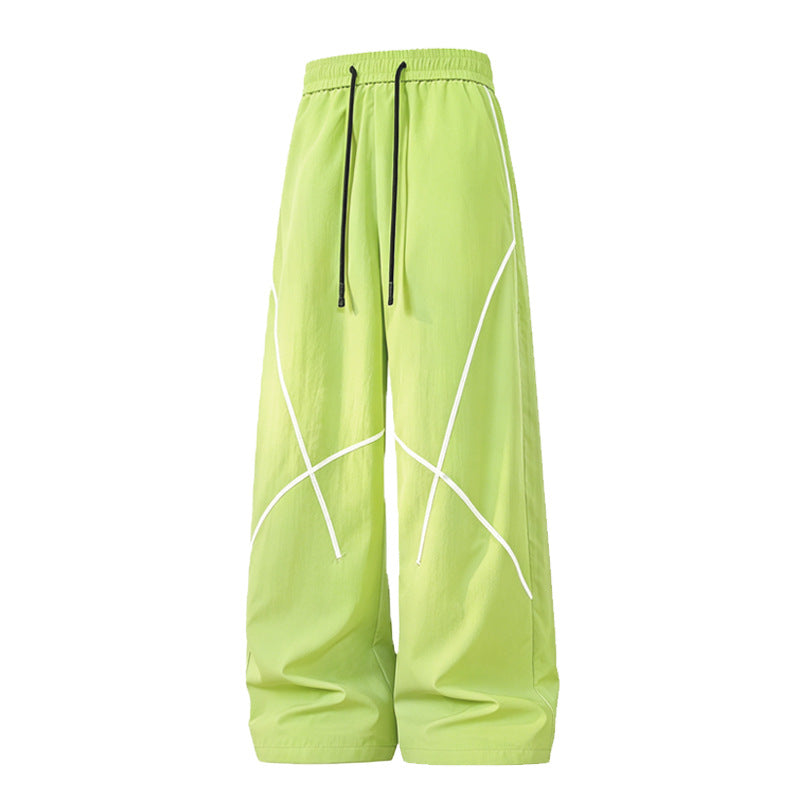 Herren Weite Funktions-Nylonhose mit Kordelbund, reflektierenden Nahtdetails & lässiger Baggy‑Silhouette Echoarchiv