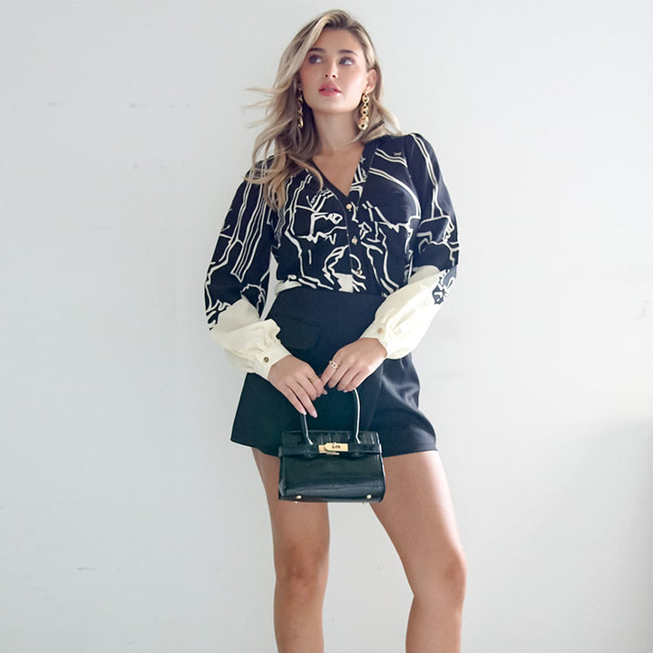 Damen V-Ausschnitt-Bluse mit abstraktem Grafikprint, Ballonärmeln und kontrastierenden Manschetten – Avérine