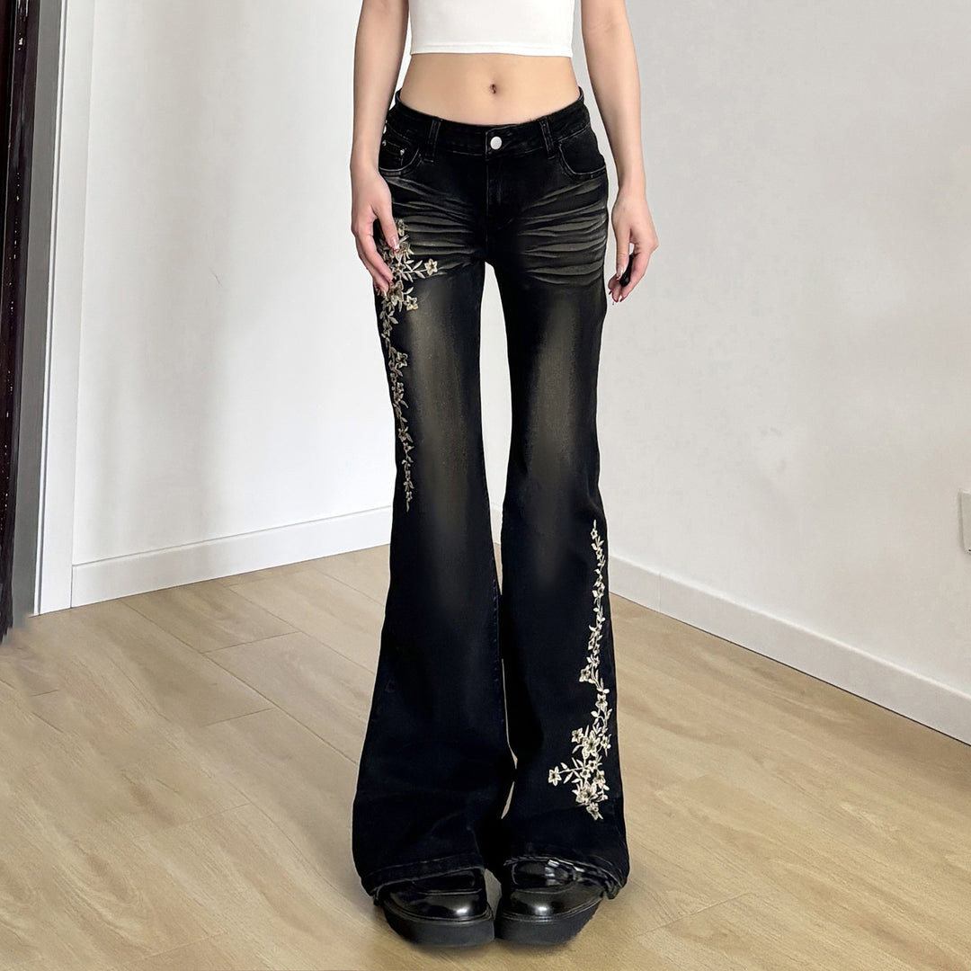 Damen hochtaillierte Schlagjeans mit floraler Stickerei und verwaschenem Look Echo Archiv