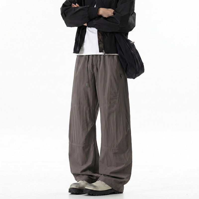Herren Weite Baggy‑Hose mit Tunnelzugbund und Paneel‑Konstruktion Echo Archiv