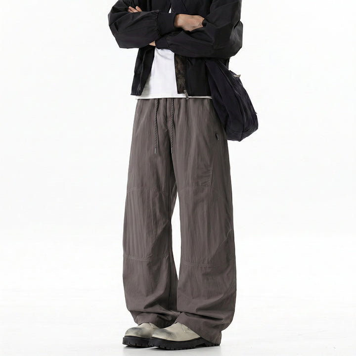 Herren Weite Baggy‑Hose mit Tunnelzugbund und Paneel‑Konstruktion Echo Archiv