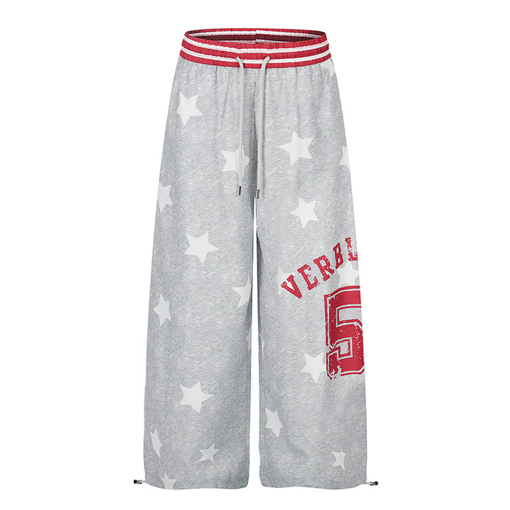 Damen Palazzo-Loungehose im Athleisure-Stil mit Stern-Allover, hohem Rippbund und Statement-Print Echoarchiv