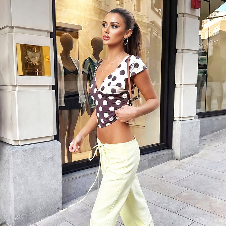 Damen Modisches Polka-Dots Oberteil mit tiefem V-Ausschnitt Echo Archiv