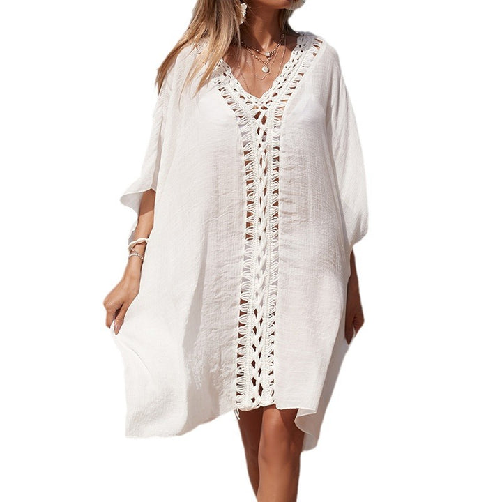 Damen eleganter Strandponcho mit raffinierten Häkelakzenten und tiefem V-Ausschnitt Echo Archiv