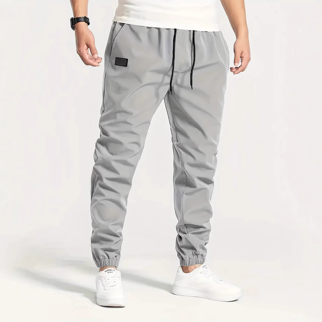 Herren Technische Jogginghose im Tapered‑Utility‑Stil mit elastischem Bund & Knöchelbündchen Echo Archiv