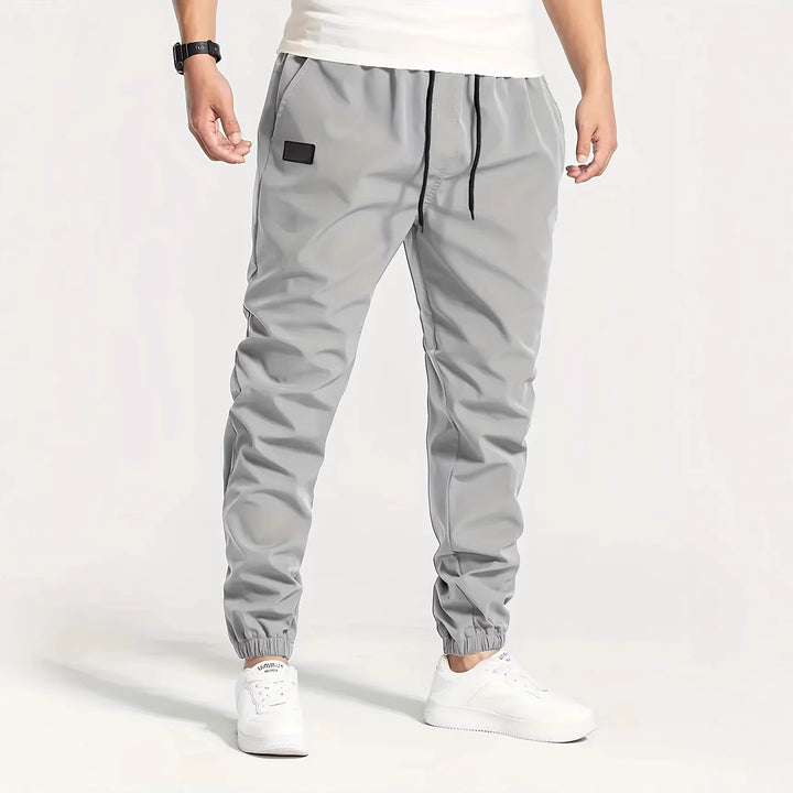 Herren Technische Jogginghose im Tapered‑Utility‑Stil mit elastischem Bund & Knöchelbündchen Echo Archiv