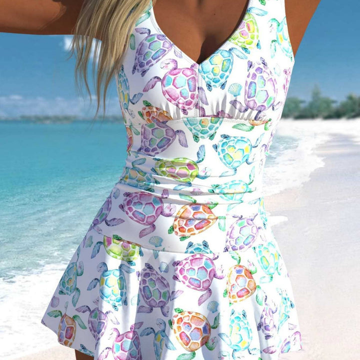 Damen Schwimmdress mit fröhlichem Schildkrötenmotiv und elegantem Rocksaum Echo Archiv