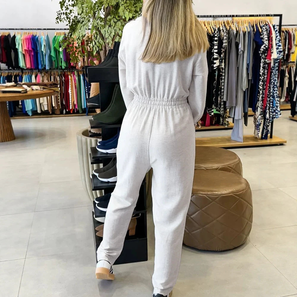 Damen Stilvoller Jumpsuit mit Wickeldesign und Taillengürtel Echo Archiv