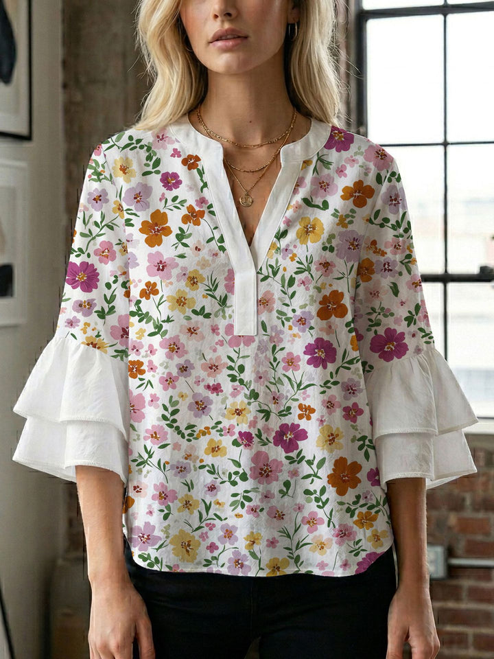 Damen Blusenshirt mit voluminösen Ärmeln und kreativem Druckdesign Echo Archiv